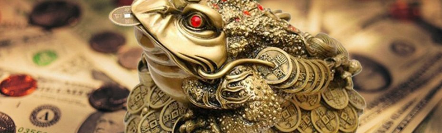 一只蟾蜍，嘴里有硬币 - 一个吸引金钱的护身符